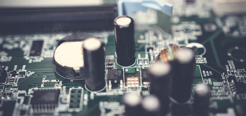 Selective Focus Photo of Electrolytic Capacitors on Circuit Board