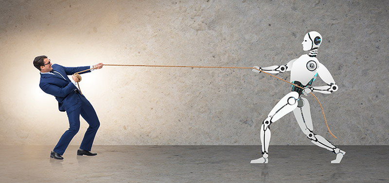 man playing tug of war against a machine with a rope