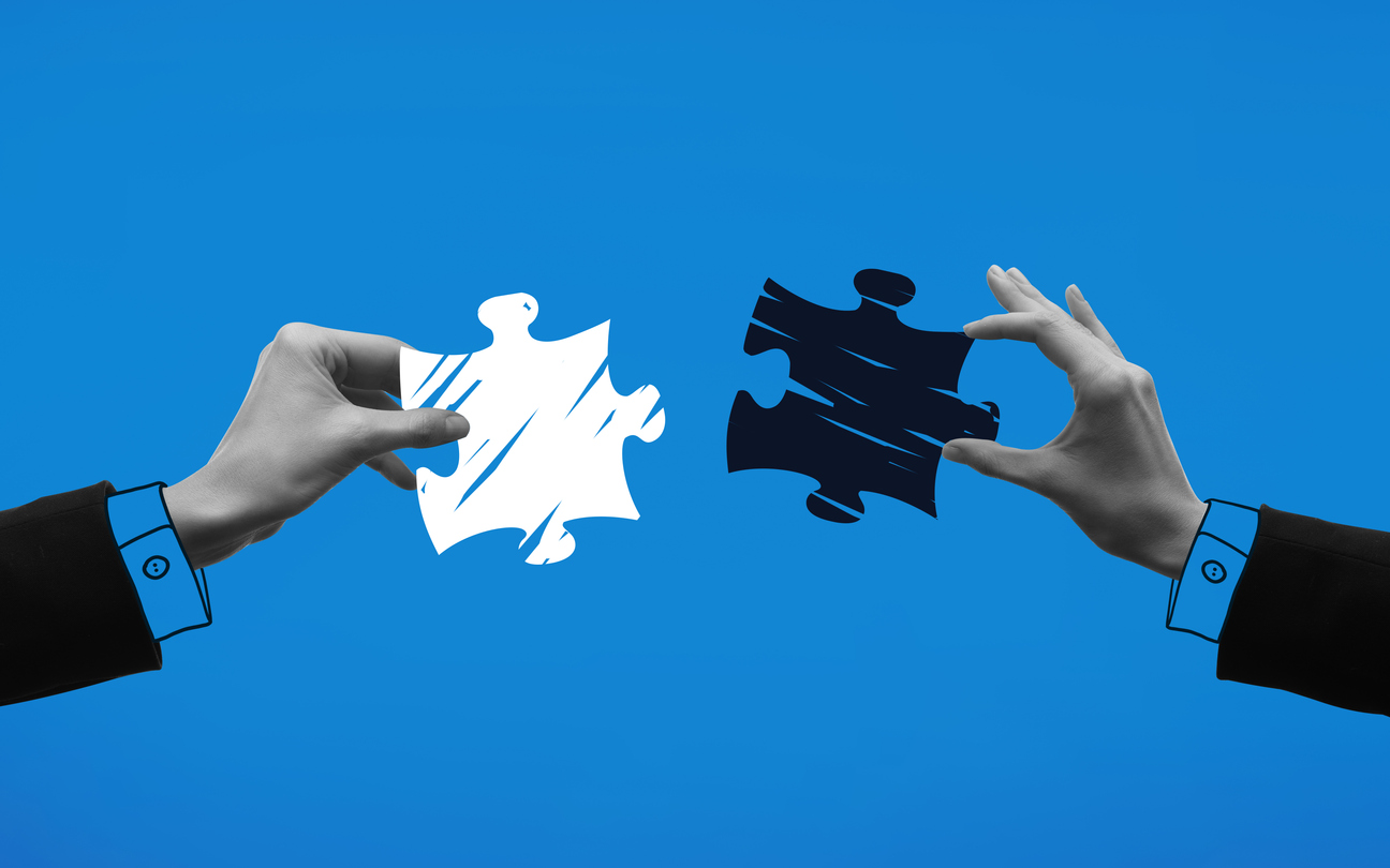 Contemporary art collage. Hands holding puzzle pieces and trying to connect it against blue background. Concept of business, acquisition, retention, merger, partnership, office,