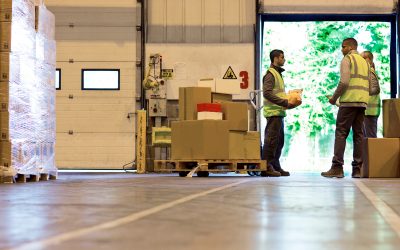 Workers talking in warehouse