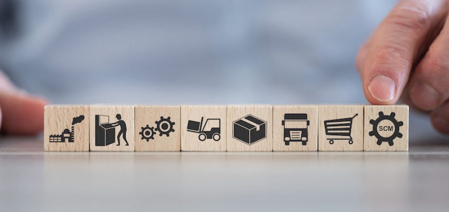 Concept of SCM with icons on wooden cubes