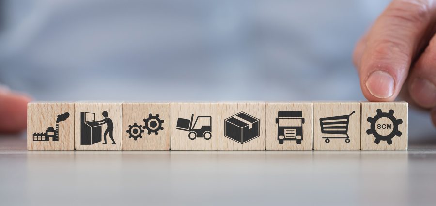 Concept of SCM with icons on wooden cubes