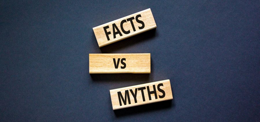 Facts vs myths symbol. Concept words Facts vs myths on wooden blocks on a beautiful black table black background. Business, finacial and facts vs myths concept. Copy space.