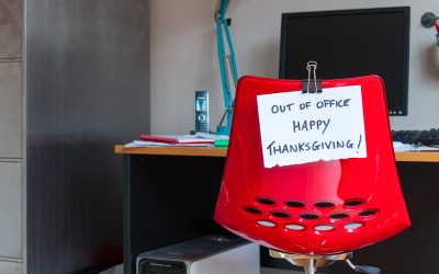 Employee leaves note on back of office chair: Out of Office. Happy Thanksgiving!