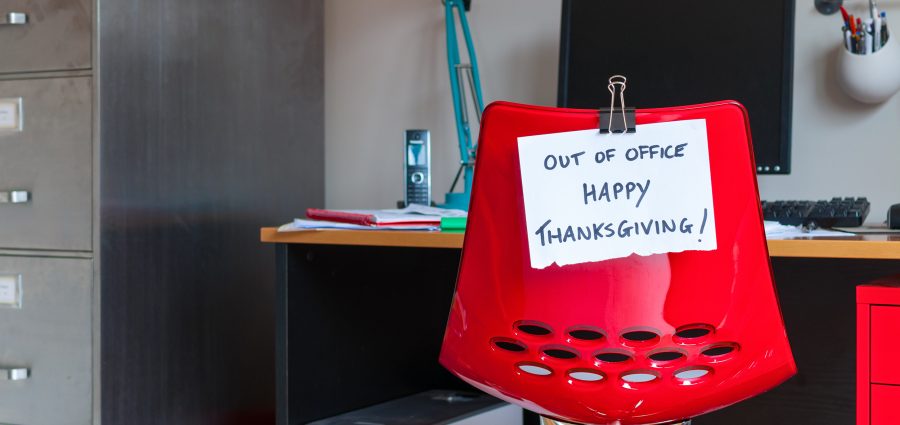 Employee leaves note on back of office chair: Out of Office. Happy Thanksgiving!