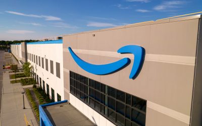 Toronto, Ontario, Canada - September 11, 2022: Amazon logo on the new build modern building. Amazon Smile Arrow logo and brand trademark. Fulfillment center warehouse and office building.