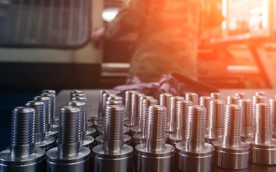 New steel threaded bolts on table