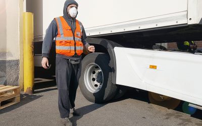 young worker at express courier with Coronavirus protection mask