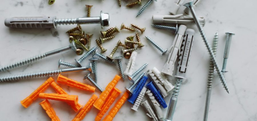 a bunch of multi-colored fasteners