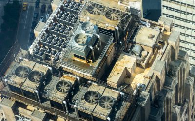 air conditioning units on the roof of a tall building