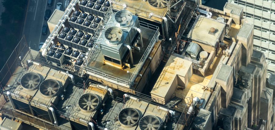 air conditioning units on the roof of a tall building