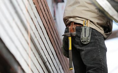 Man Wearing Black Denim Pants With Carrying Hammer on Holster