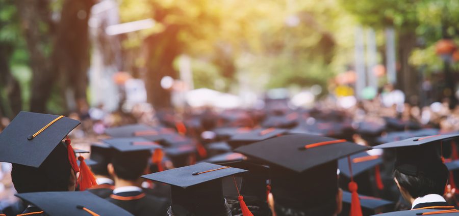 backside graduation hats during commencement success graduates o