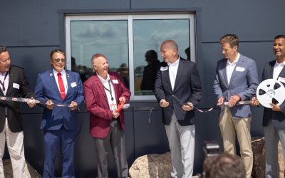 Digi-Key officially opened its 2.2 million square foot Product Distribution Center expansion (PDCe) with a Digi-Reel cutting and ceremonial package handoffs today. Pictured: Chris Lauer, vice president, order fulfillment, Digi-Key; Thief River Falls Mayor Brian Holmer; Dr. Ron Stordahl, owner, Digi-Key; Dave Doherty, president, Digi-Key; Minnesota Department of Employment and Economic Development Commissioner Steve Grove; and Ramesh Babu, CIO, Digi-Key.