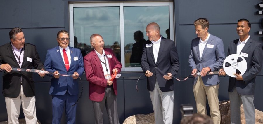 Digi-Key officially opened its 2.2 million square foot Product Distribution Center expansion (PDCe) with a Digi-Reel cutting and ceremonial package handoffs today. Pictured: Chris Lauer, vice president, order fulfillment, Digi-Key; Thief River Falls Mayor Brian Holmer; Dr. Ron Stordahl, owner, Digi-Key; Dave Doherty, president, Digi-Key; Minnesota Department of Employment and Economic Development Commissioner Steve Grove; and Ramesh Babu, CIO, Digi-Key.