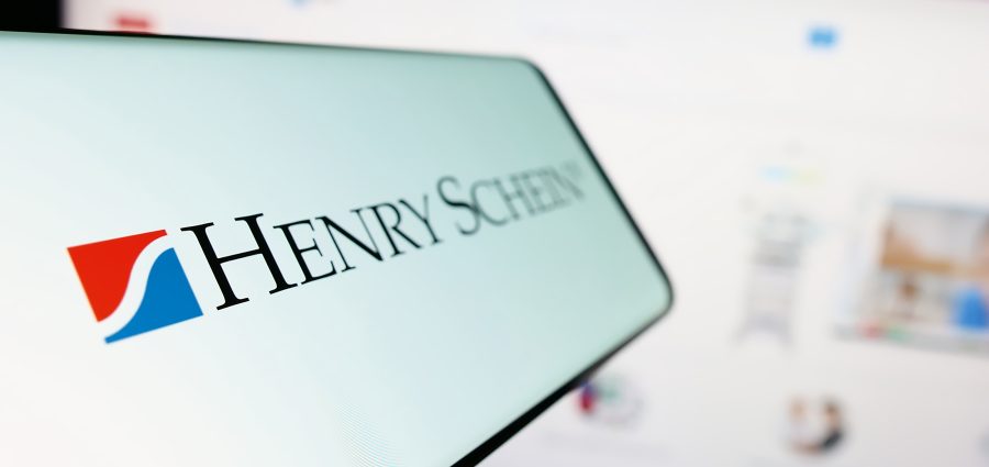 Stuttgart, Germany - 07-02-2023: Cellphone with logo of American healthcare products company Henry Schein Inc. on screen in front of website. Focus on left of phone display.