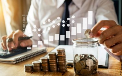 businessman holding coins putting in glass with using smartphone