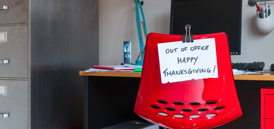 Employee leaves note on back of office chair: Out of Office. Happy Thanksgiving!