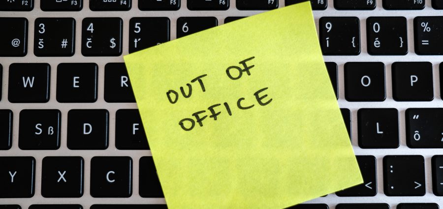 Vacation needed. Holiday office message on laptop. Out of office