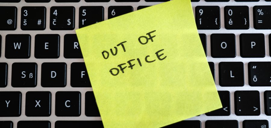 Vacation needed. Holiday office message on laptop. Out of office