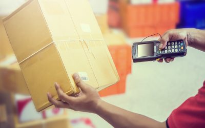 Worker Scanning Package In Warehouse