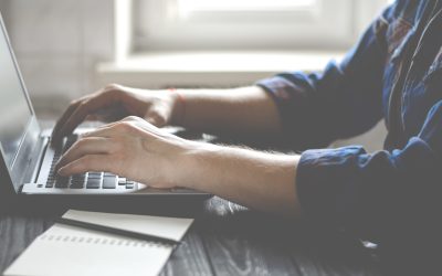 Freelancer works on a laptop in the home office