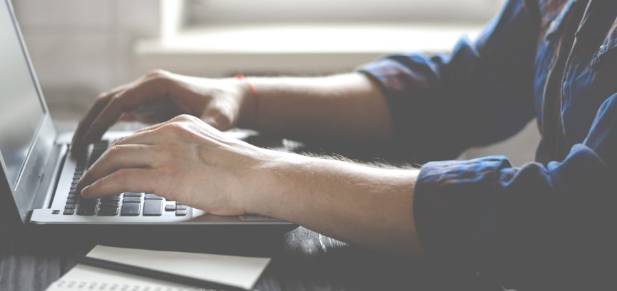 Freelancer works on a laptop in the home office