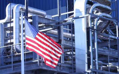 American Flag flying in front of manufacturing factory