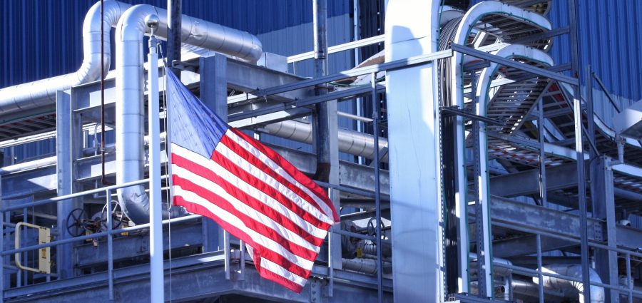 American Flag flying in front of manufacturing factory