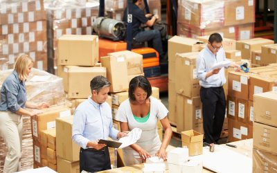 Workers In Warehouse Preparing Goods For Dispatch