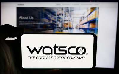 Stuttgart, Germany - 07-24-2024: Person holding cellphone with logo of US HVAC distribution company Watsco Inc. in front of business webpage. Focus on phone display.