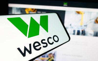 Stuttgart, Germany - 07-05-2024: Mobile phone with logo of American electronics company WESCO International Inc. in front of business website. Focus on center of phone display.