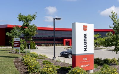 outside photo of Wurth headquarters building sign and black building in background