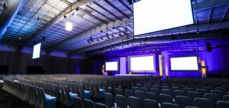 Rows of empty chairs in large Conference hall for Corporate Convention or Lecture