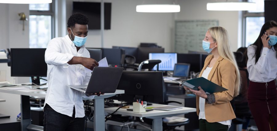 young workers with masks