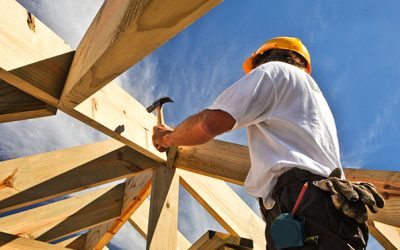 roofer ,carpenter working on roof structure at construction site