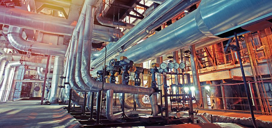 Equipment, cables and piping as found inside of a modern industrial power plant