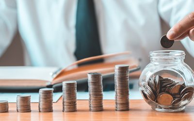 Financial businessman with coins put in a jar, Saving money for future growth and knowing how to manage your spending wisely, Saving money for business growth or long-term profitability.