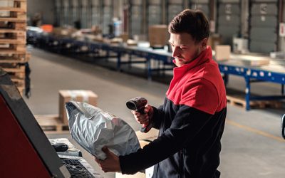 Courier picks up package on a warehouse.